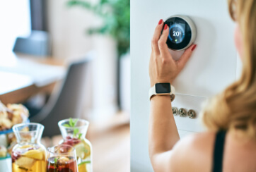 woman adjusting digital thermostat